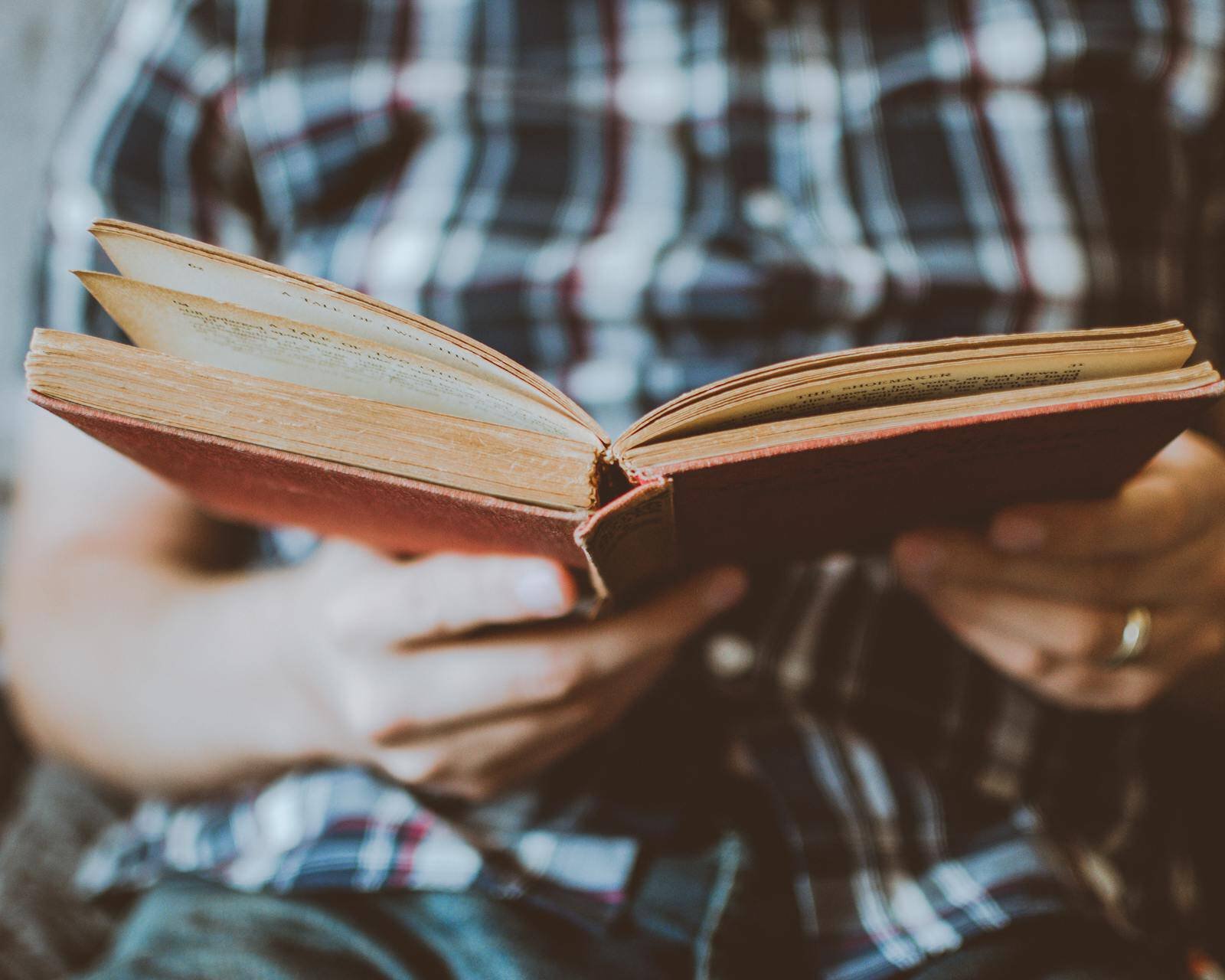 Man Holding a open book