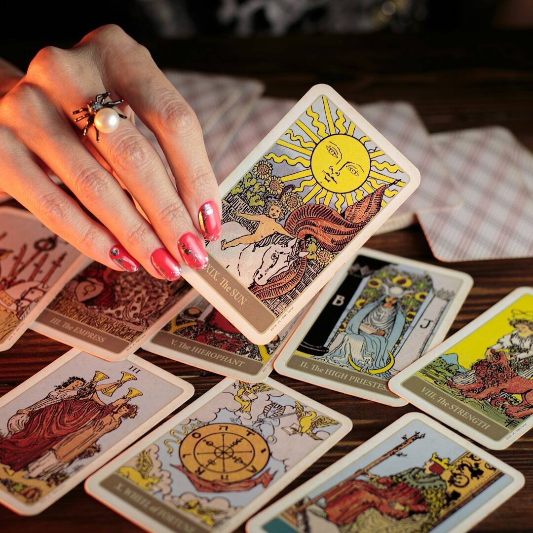 Tarot card holding in hand